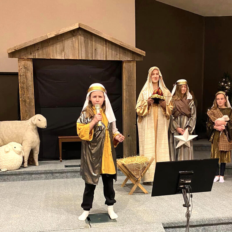 Kids performing a Christmas play on a church stage