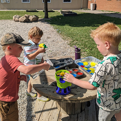 Preschoolers playing outside