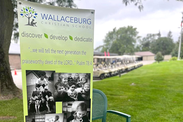 Wallaceburg Christian School promotional banner set up at a golf course